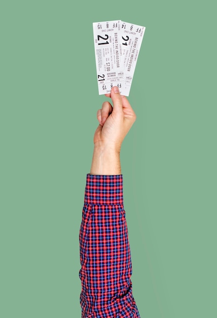 hand holding cinema tickets
