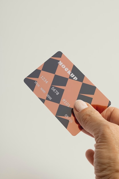 PSD hand holding credit card in studio