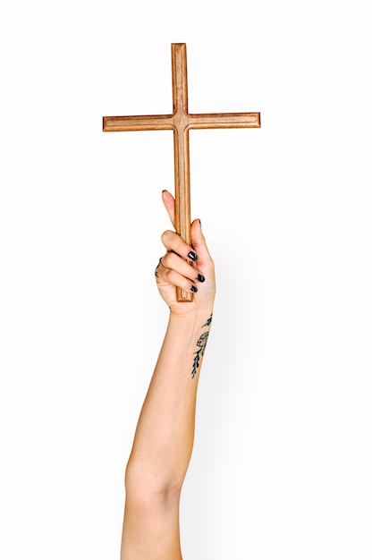 Hand holding cross