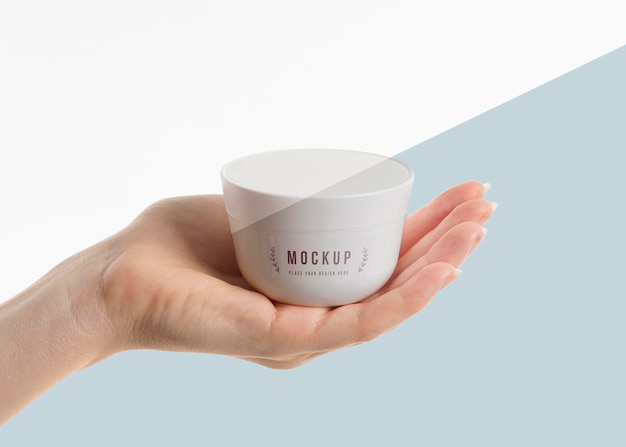 PSD hand holding a cup mock-up