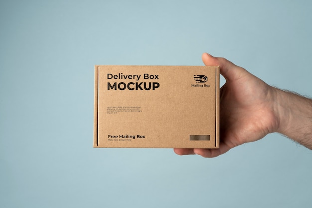 PSD hand holding delivery pack mockup