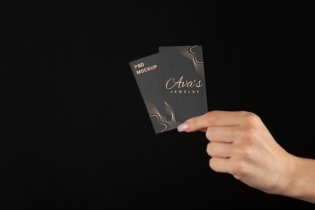 PSD hand holding embossed business card