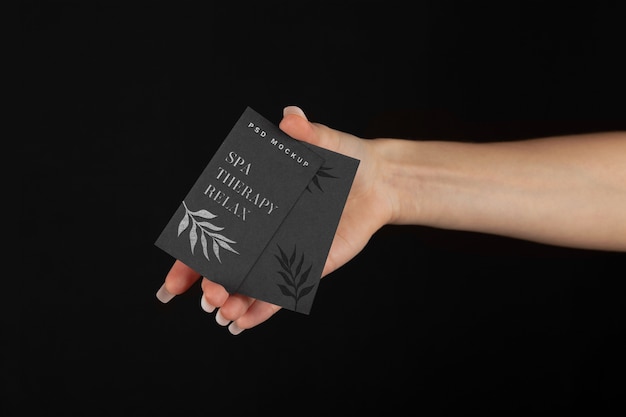 PSD hand holding embossed business card