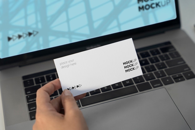 PSD hand holding gift card mockup