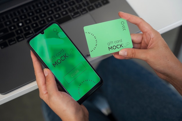 Hand holding gift card mockup