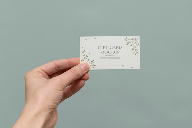 PSD hand holding gift card  mockup