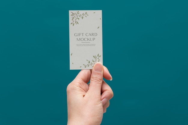 PSD hand holding gift card  mockup