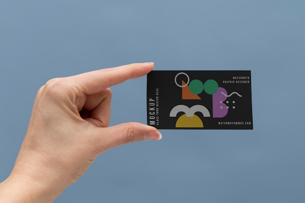 PSD hand holding gift card  mockup