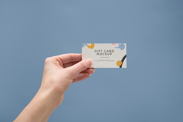 PSD hand holding gift card  mockup