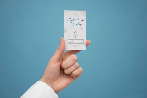 PSD hand holding gift card  mockup