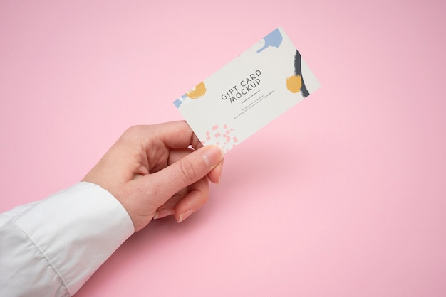 Hand holding gift card  mockup