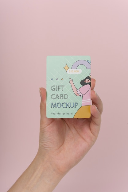 Hand holding gift card mockup