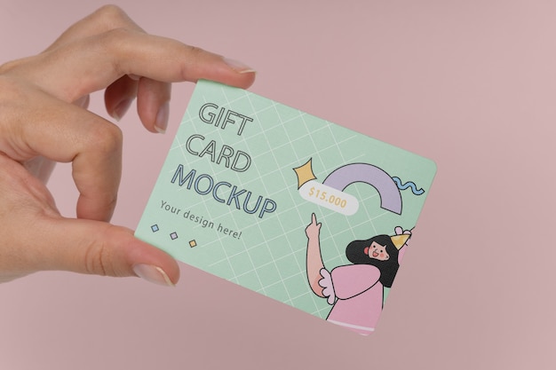 Hand holding gift card mockup