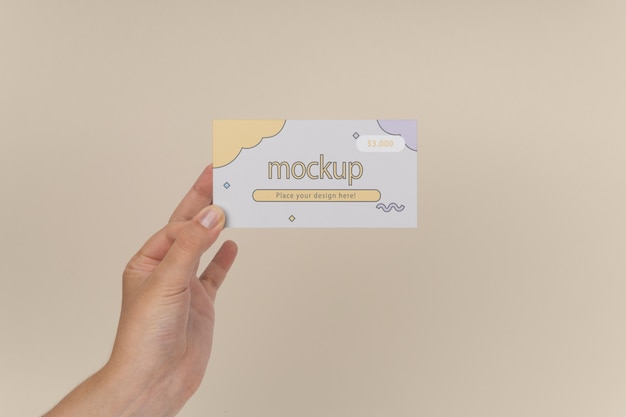 Hand holding gift card mockup