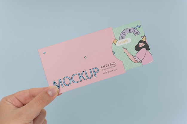 PSD hand holding gift card mockup