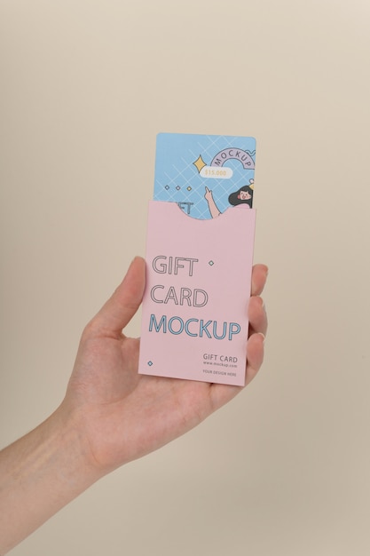 Hand holding gift card mockup