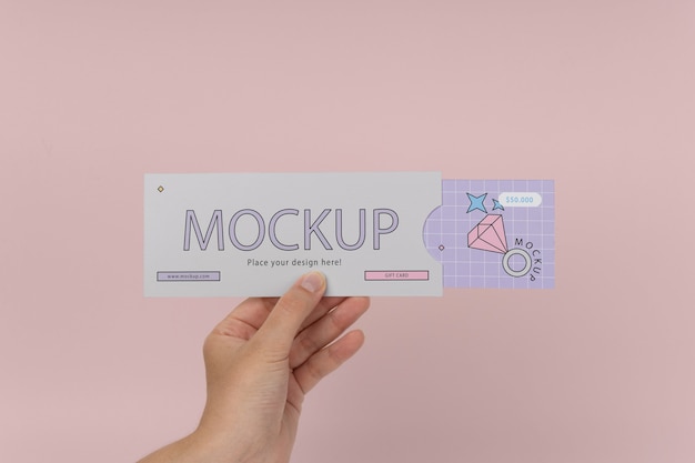 Hand holding gift card mockup