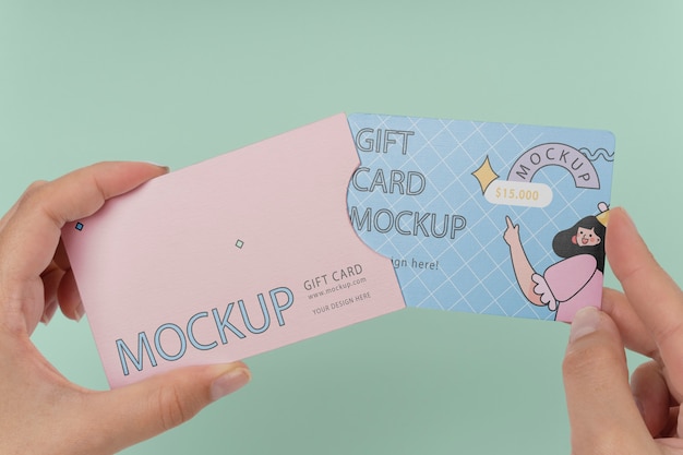 PSD hand holding gift card mockup