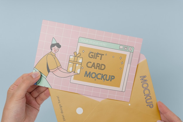 Hand holding gift card mockup