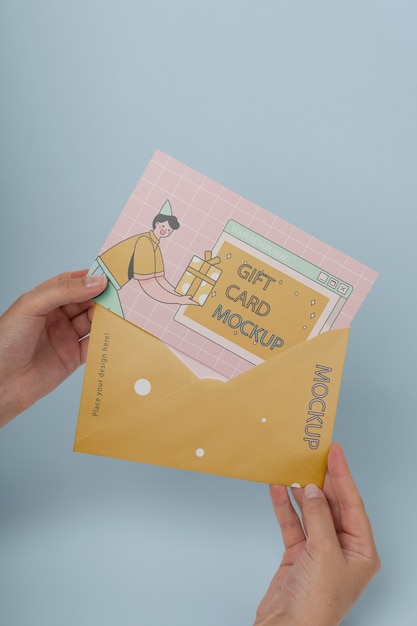 Hand holding gift card mockup