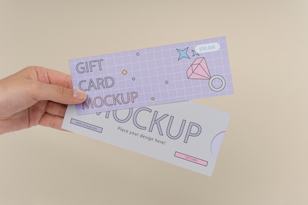 Hand holding gift card mockup