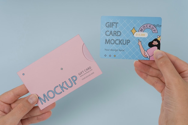 Hand holding gift card mockup