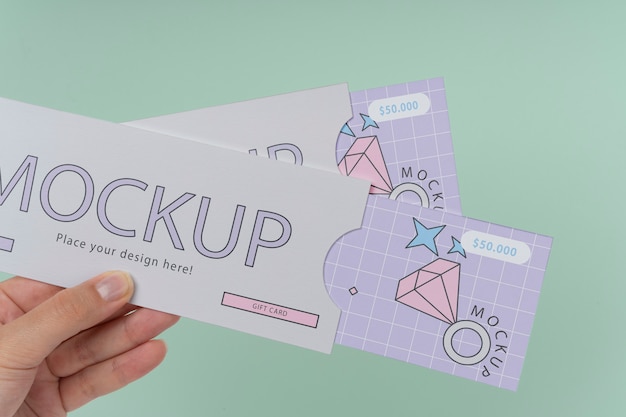 PSD hand holding gift card mockup