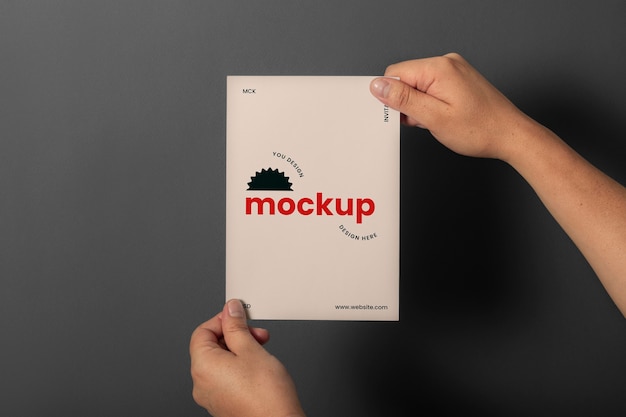 PSD hand holding greeting card mock-up design