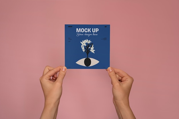 Hand holding greeting card mockup design
