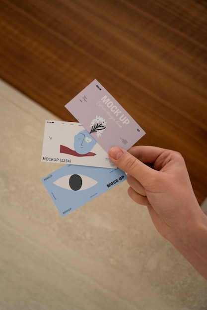 Hand holding greeting card mockup design