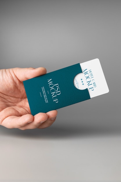 Hand holding hotel business card mockup