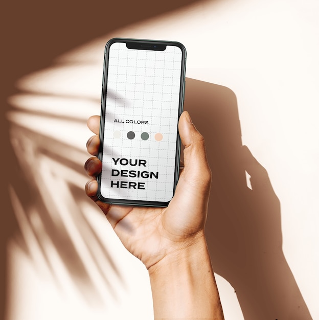 PSD hand holding new smartphone mockup