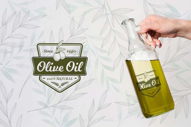 Hand holding olive oil