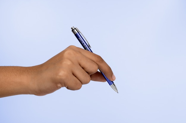 Hand holding pen mock-up