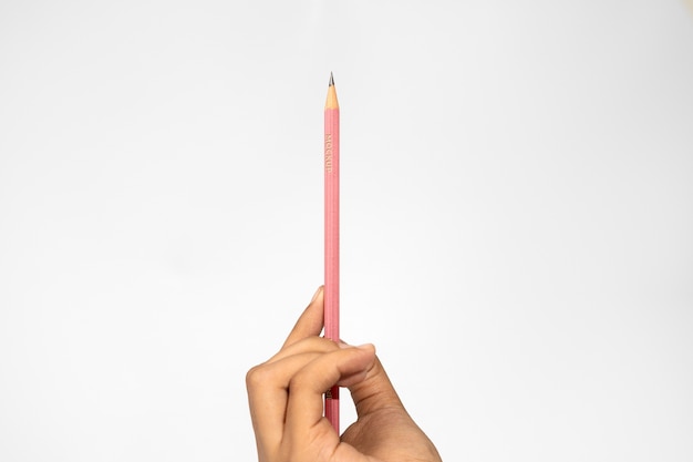 PSD hand holding pencil mockup