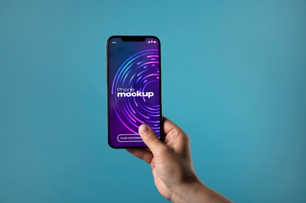 PSD hand holding phone screen mockup