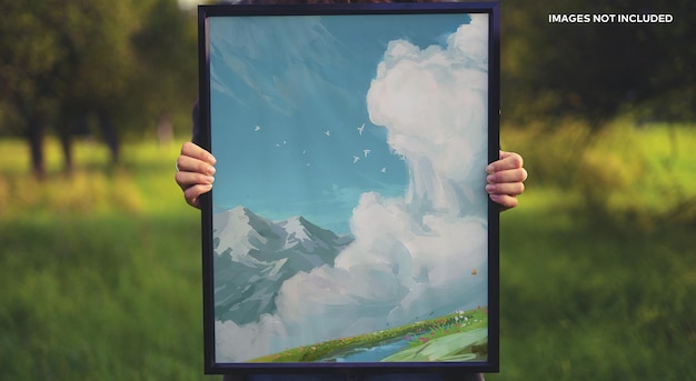 A hand holding a picture frame mockup