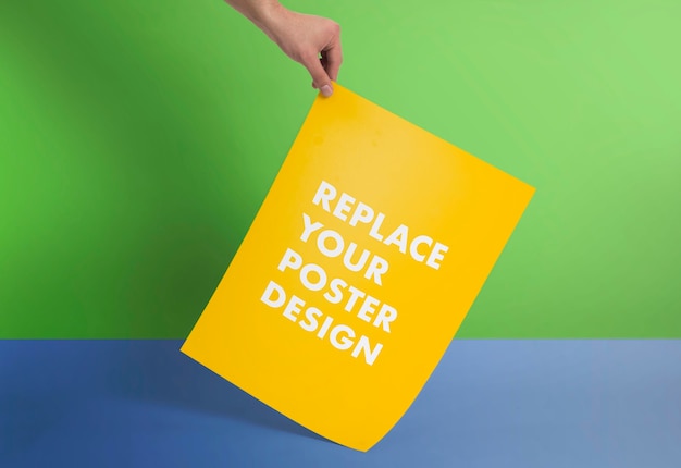 PSD hand holding poster mockup scene