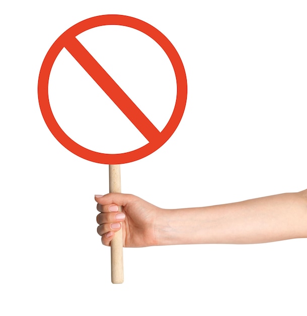 hand holding prohibition sign on empty background