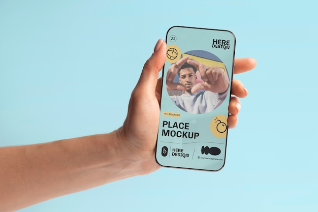 PSD hand holding smartphone mockup