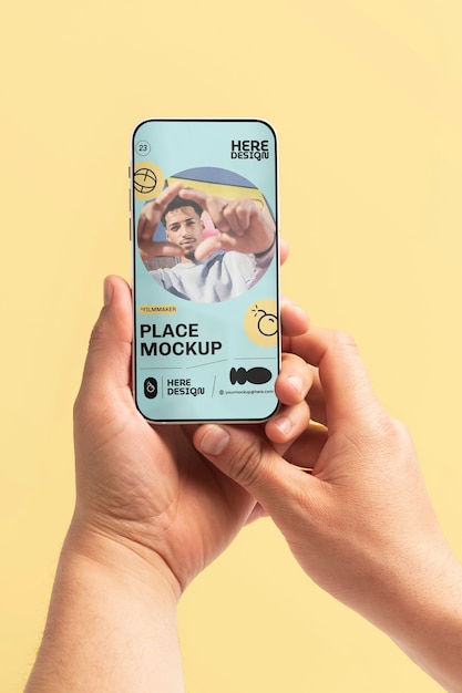 PSD hand holding smartphone mockup