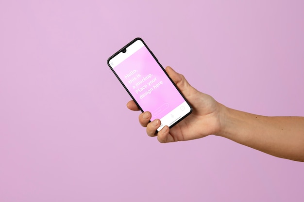 Hand holding smartphone  mockup