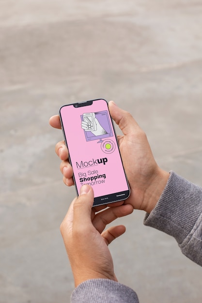 Hand holding smartphone mockup
