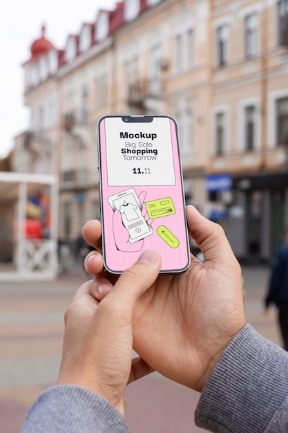 Hand holding smartphone mockup