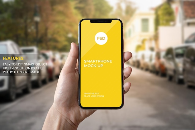 Hand holding smartphone mockup