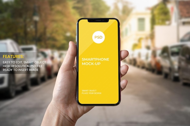 Mano che tiene smartphone mockup