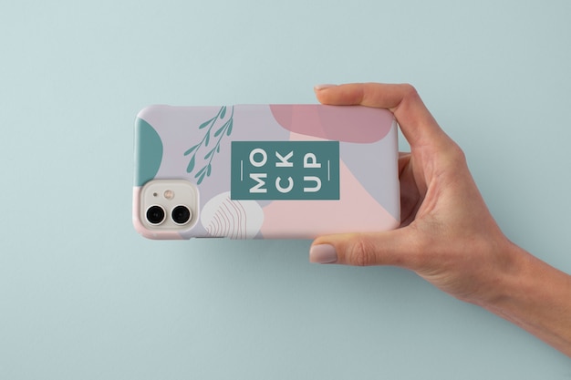 PSD hand holding smartphone with mock-up phone case