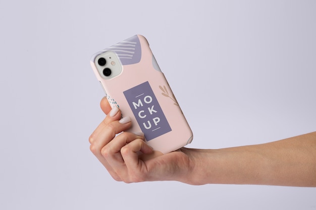 Hand holding smartphone with mock-up phone case