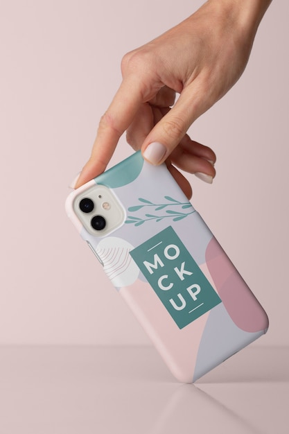 PSD hand holding smartphone with mock-up phone case