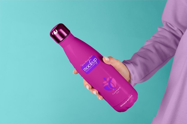 PSD hand holding thermos mockup